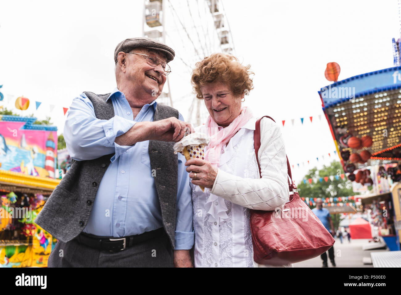 Senior couple having fun together on fair Stock Photo