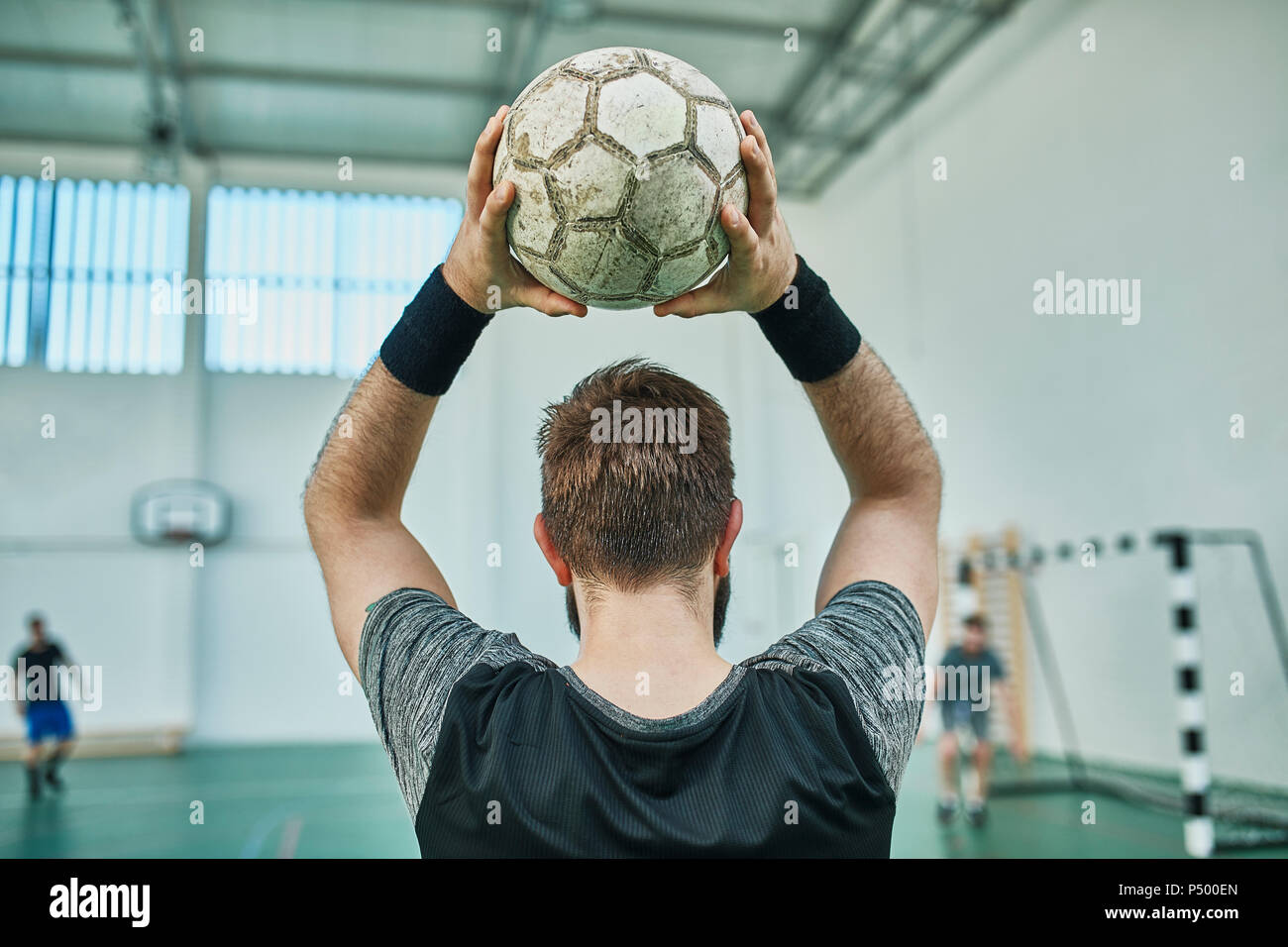 Close-up of indoor soccer player throwing in the ball Stock Photo