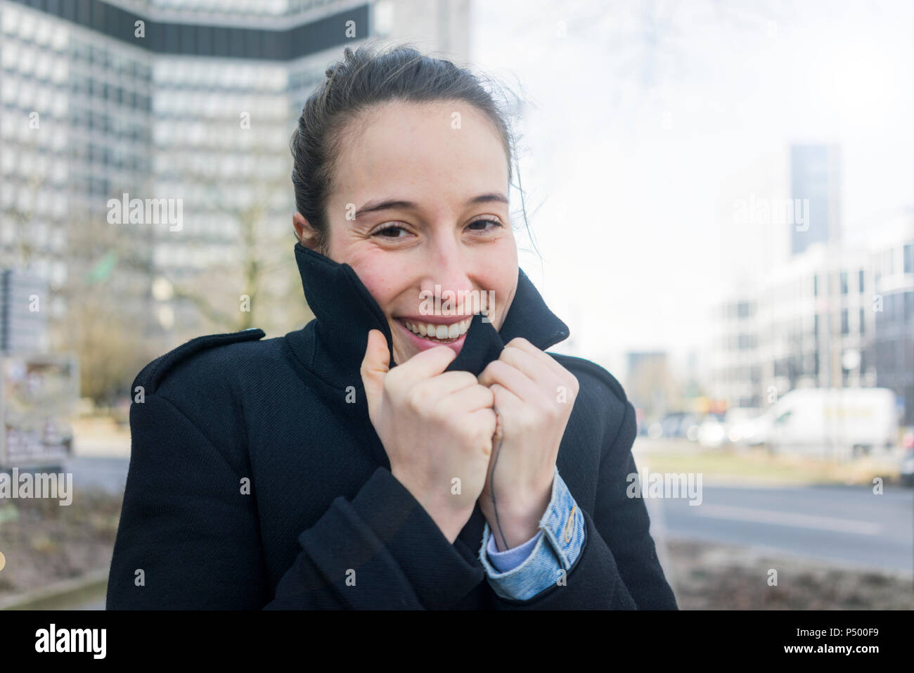 Germany, Essen, portrait of freezing young woman Stock Photo