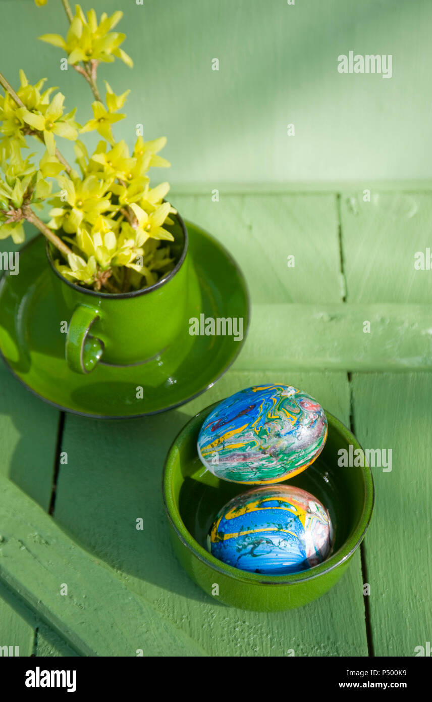 Easter eggs painted with nail varnish in bowl Stock Photo