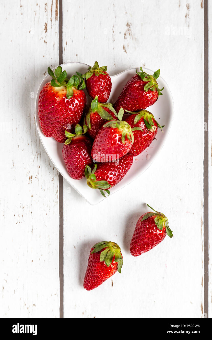 Strawberries in heart-shaped bowl Stock Photo