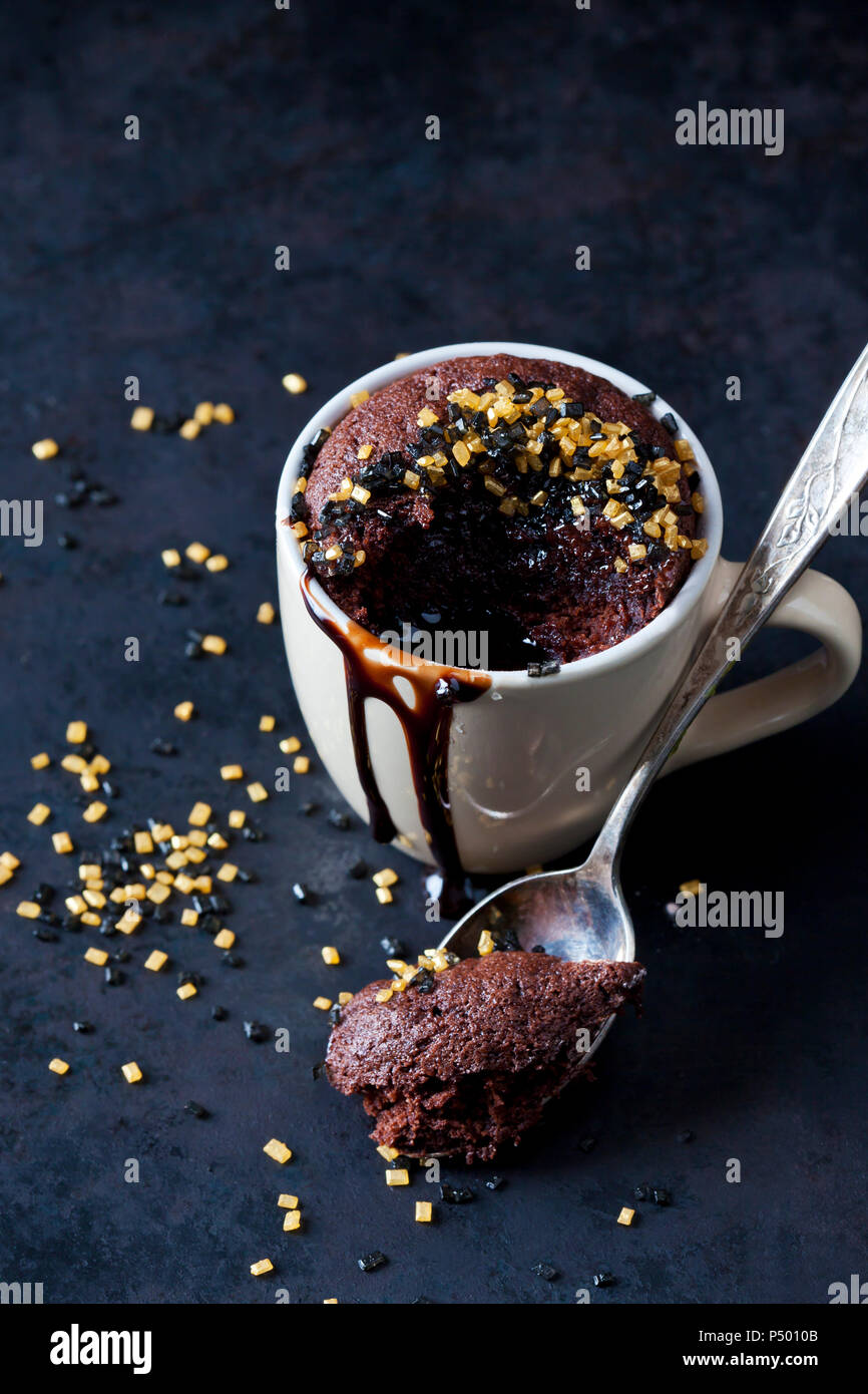 Chocolate cup cake with chocolate sauce and sugar granules Stock Photo