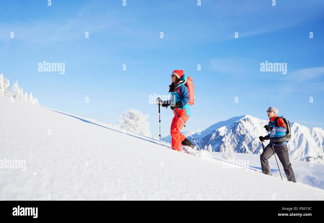 Austria, Tyrol, couple snowshoeing Stock Photo