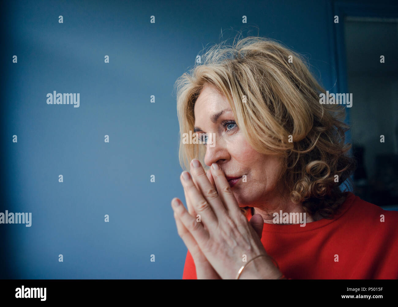 Portrait of thoughtful senior woman Stock Photo