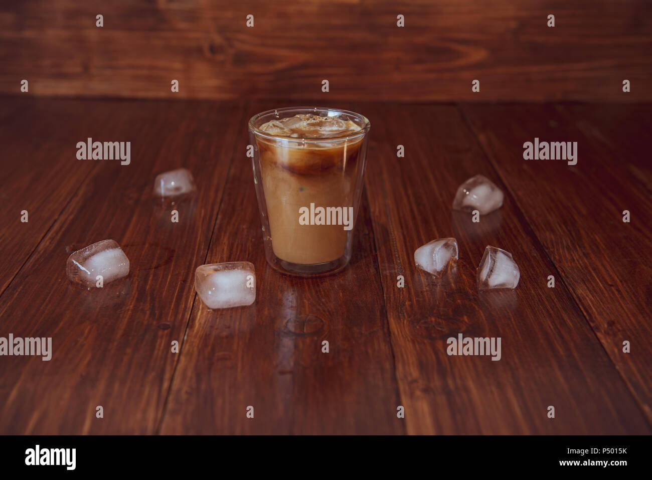 Iced coffee with ice on table Stock Photo