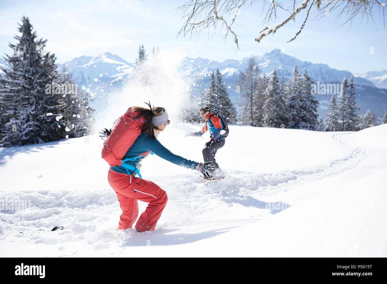 Austria, Tyrol, couple having fun in the snow Stock Photo