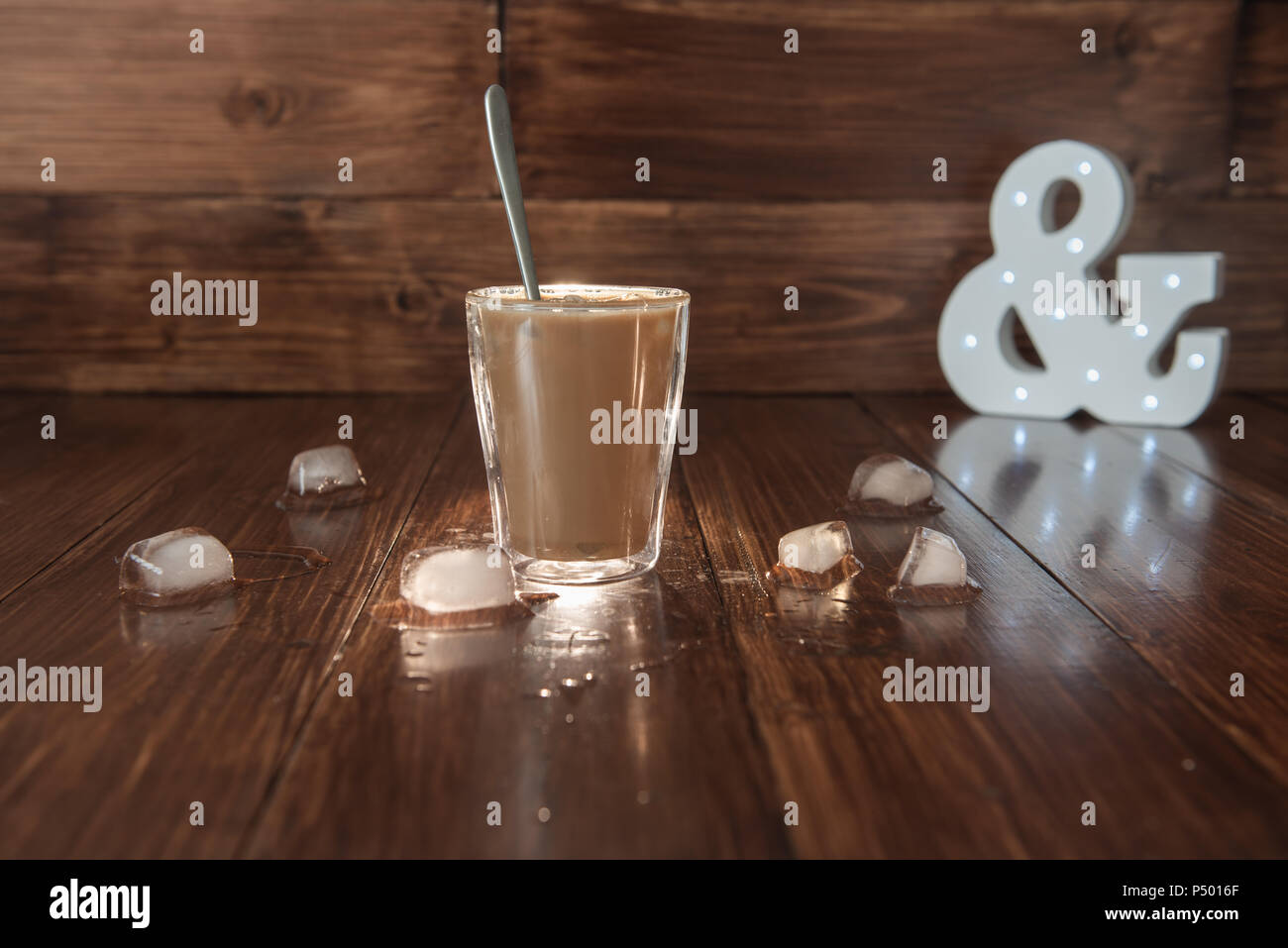 Iced coffee with ice on table Stock Photo