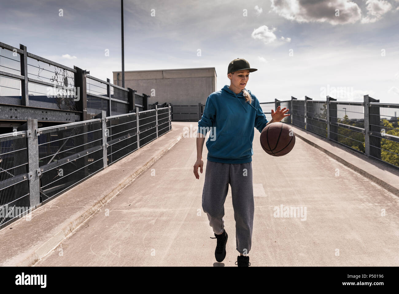 Man dribbling with basket ball Stock Photo