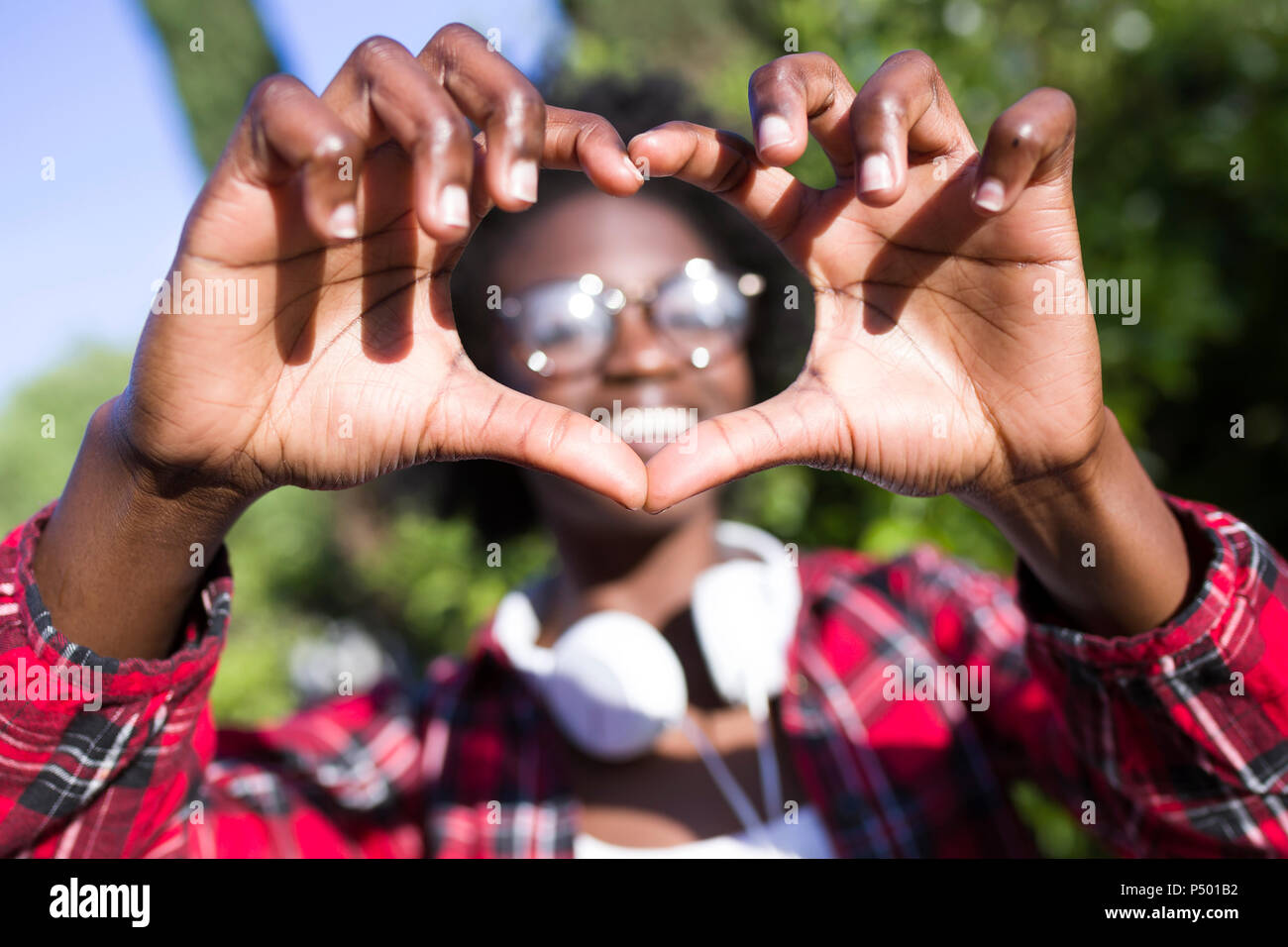 Woman's hands shaping heart Stock Photo
