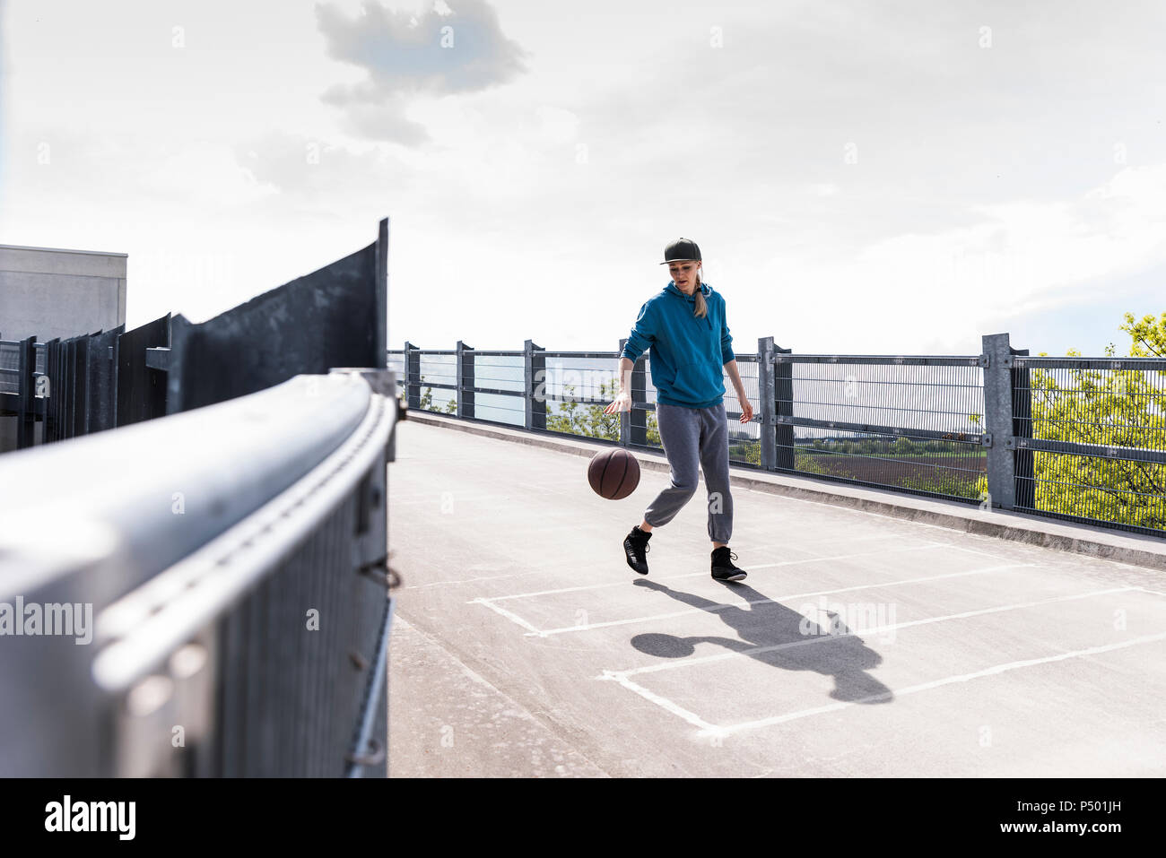 Man dribbling with basket ball Stock Photo