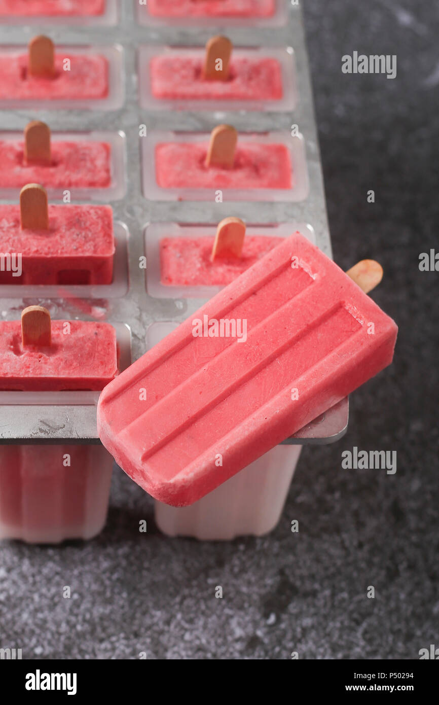 Homemade strawberry ice lollies Stock Photo