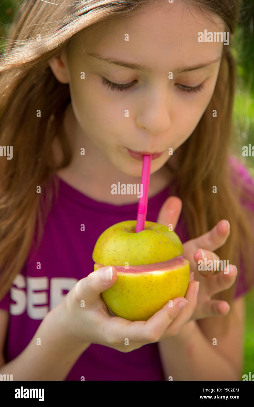 Girl drinking strawberry smoothie garden hi-res stock photography and ...