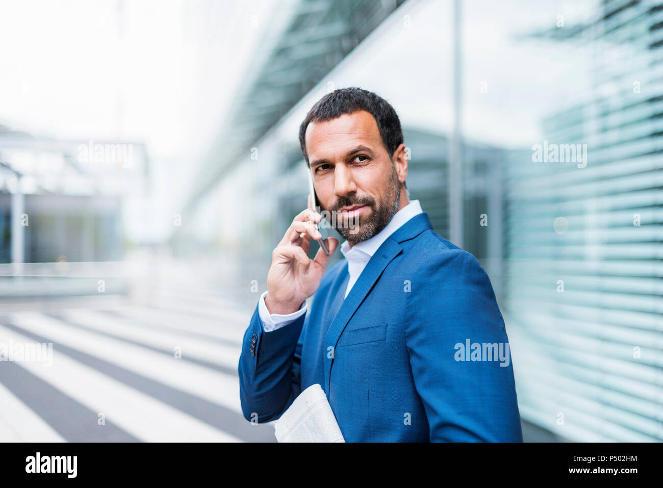 Businessman using smartphone Stock Photo
