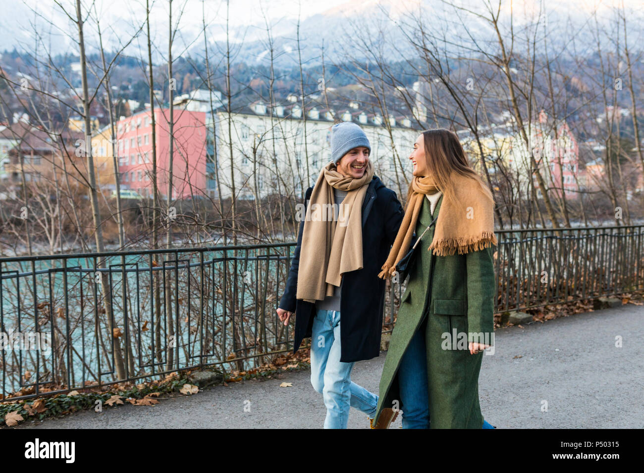 Austria, Innsbruck, happy young couple strolling together at winter time Stock Photo