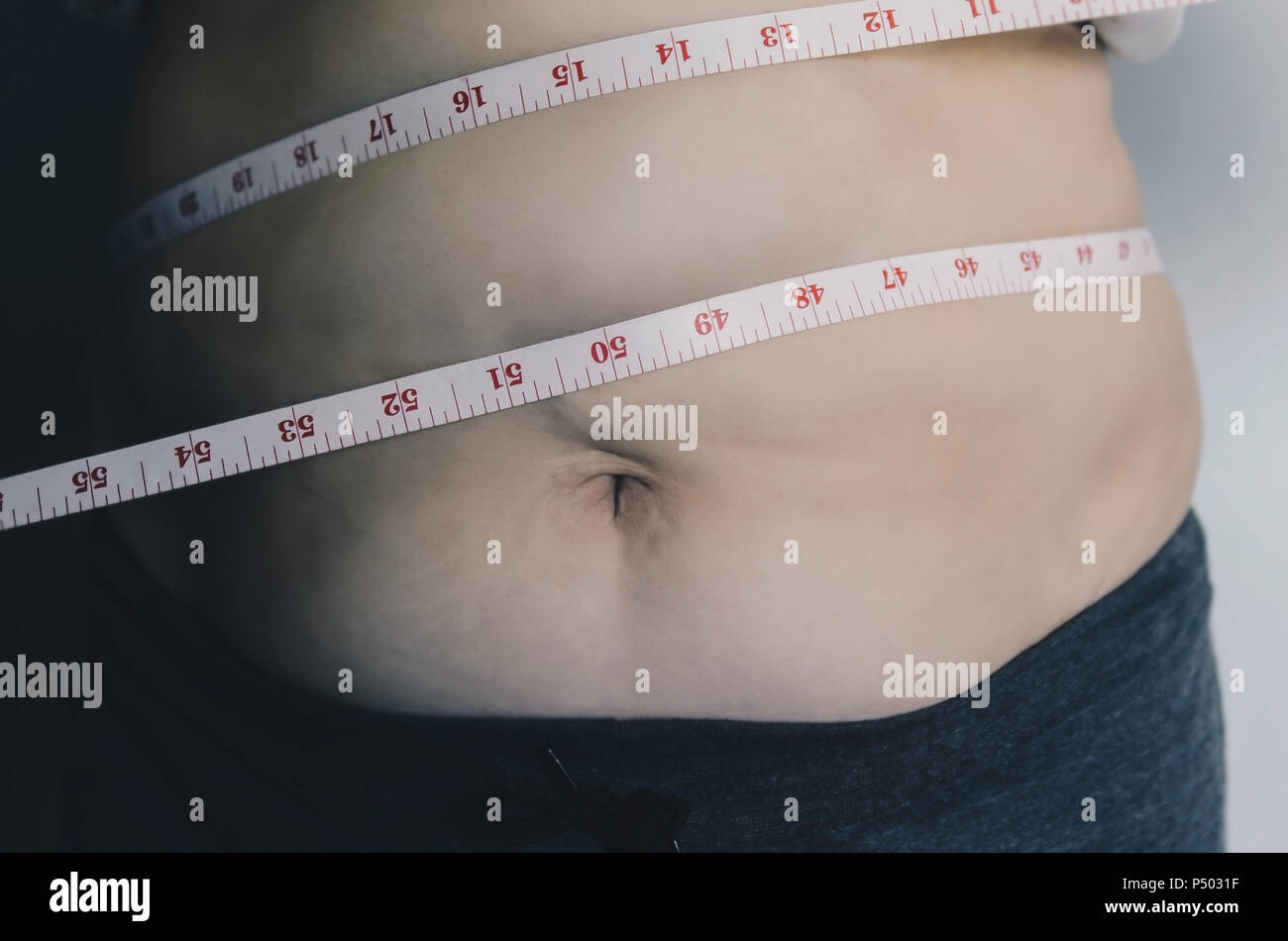 Close-up of human body and fat body, Fat body part of paunch or belly ...