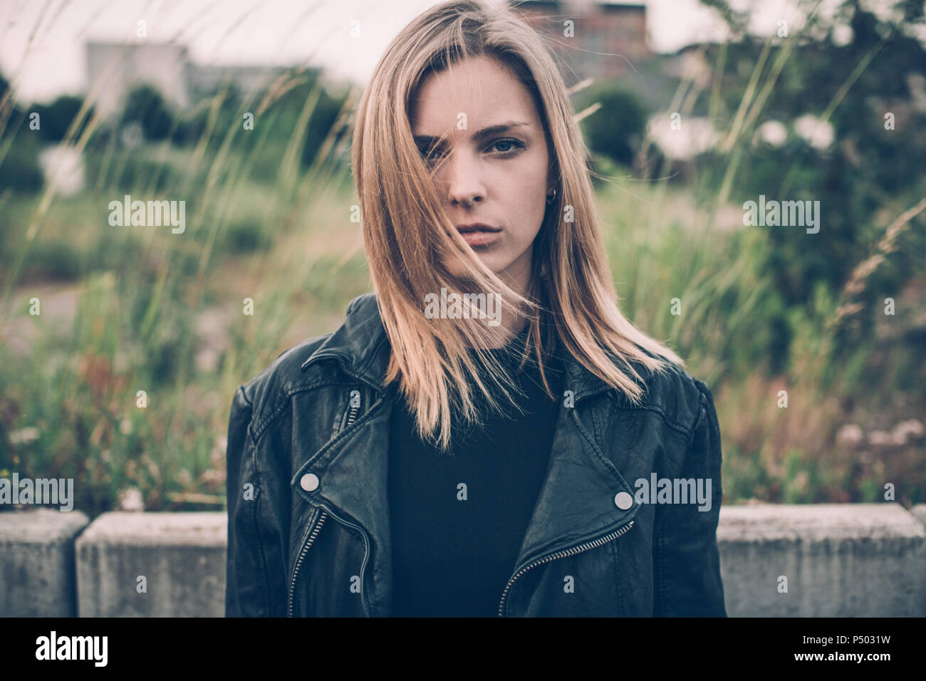 Portrait of serious young woman dressed in black Stock Photo