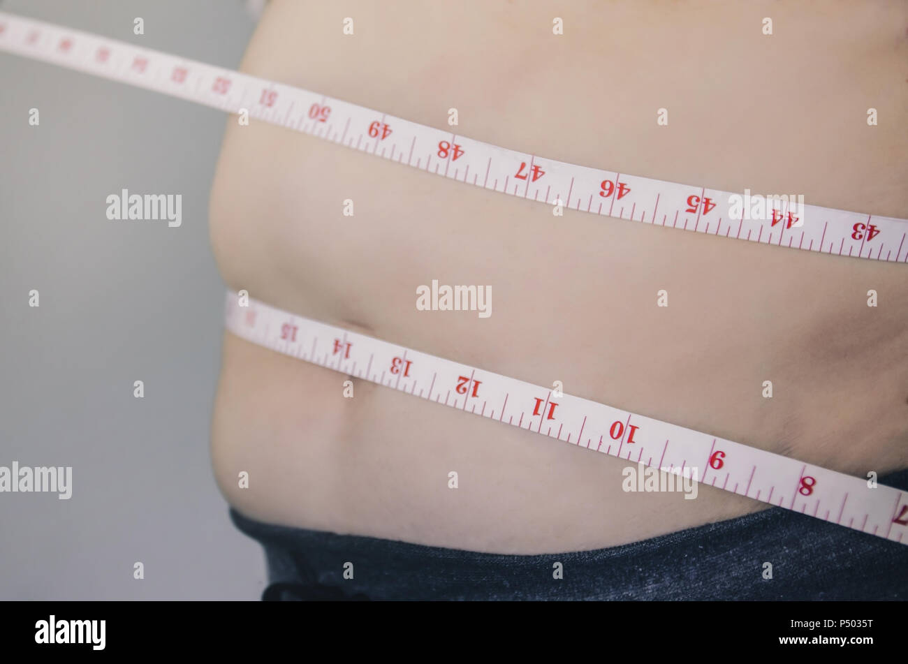 Close-up of human body and fat body, Fat body part of paunch or belly ...