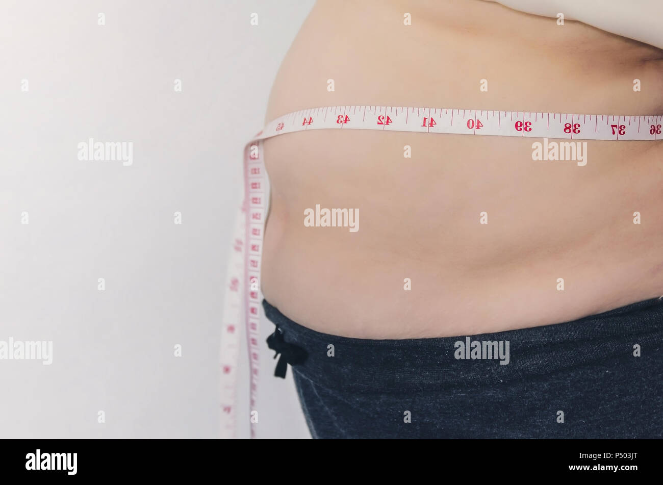 Close-up of human body and fat body, Fat body part of paunch or belly ...