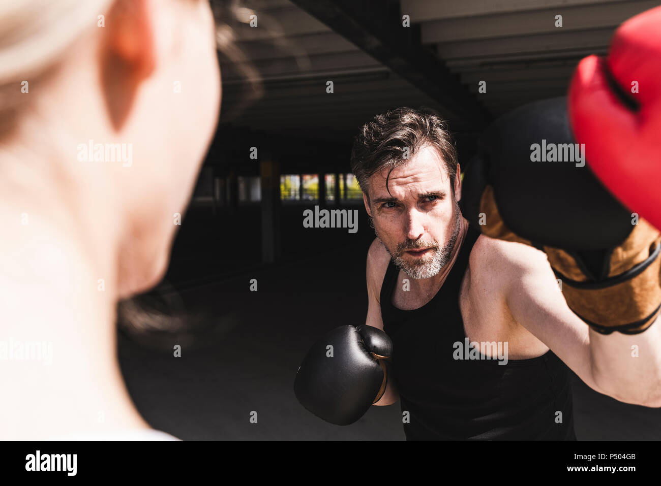Man and woman in boxing training Stock Photo