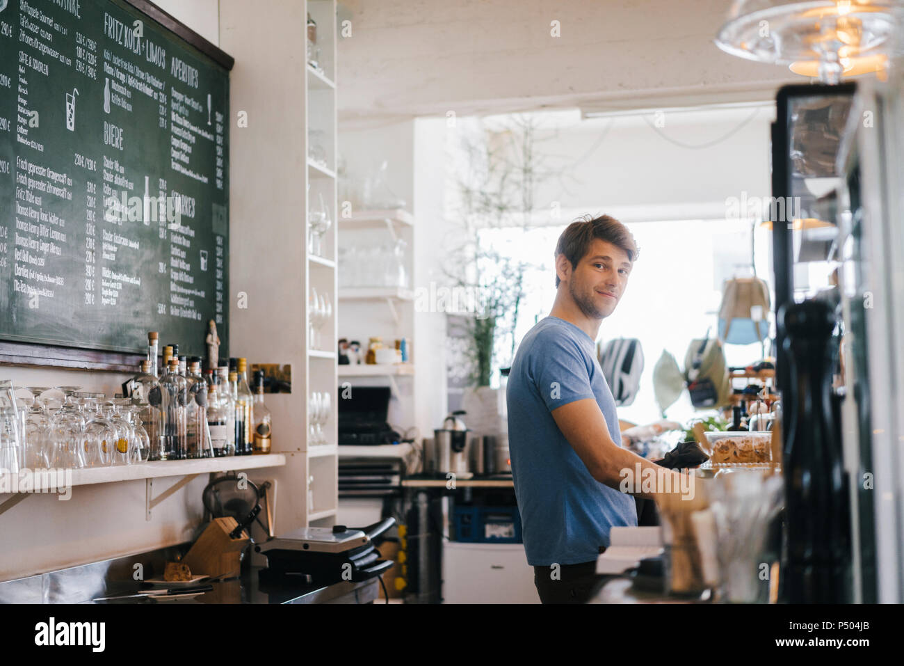 Portrait of smiling man in a cafe Stock Photo