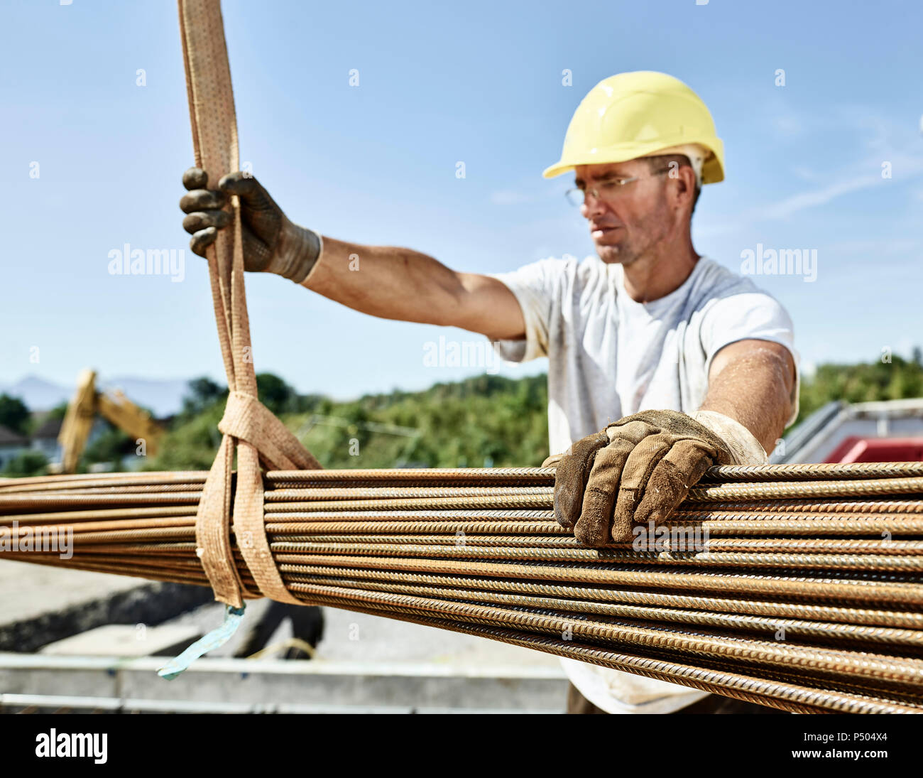 Construction worker with construction steel on construction site Stock Photo