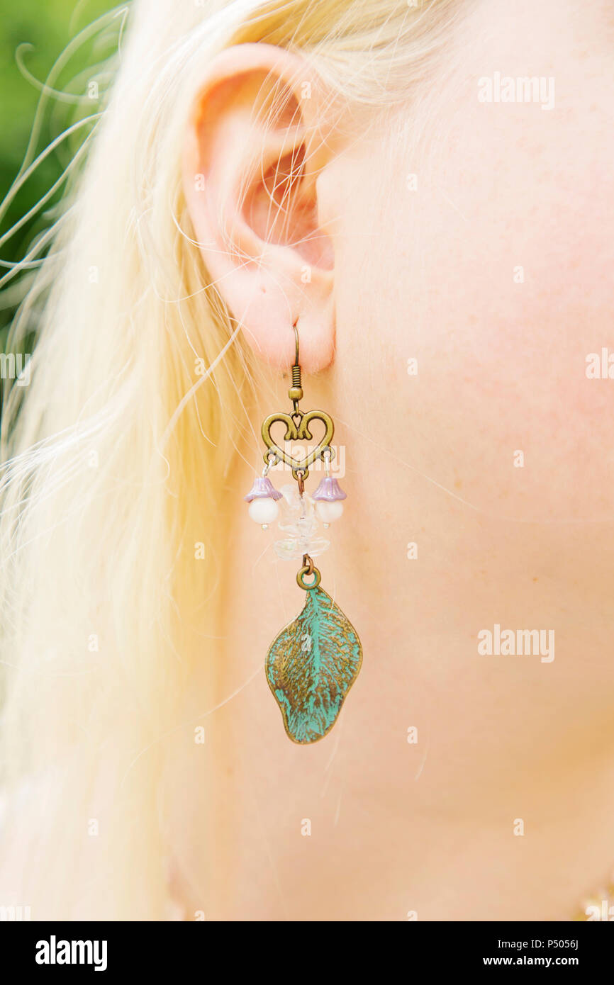 Girl wearing long bohemian earrings Stock Photo