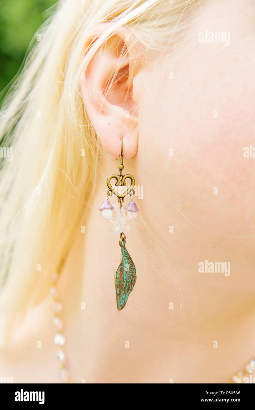 Girl wearing long bohemian earrings Stock Photo