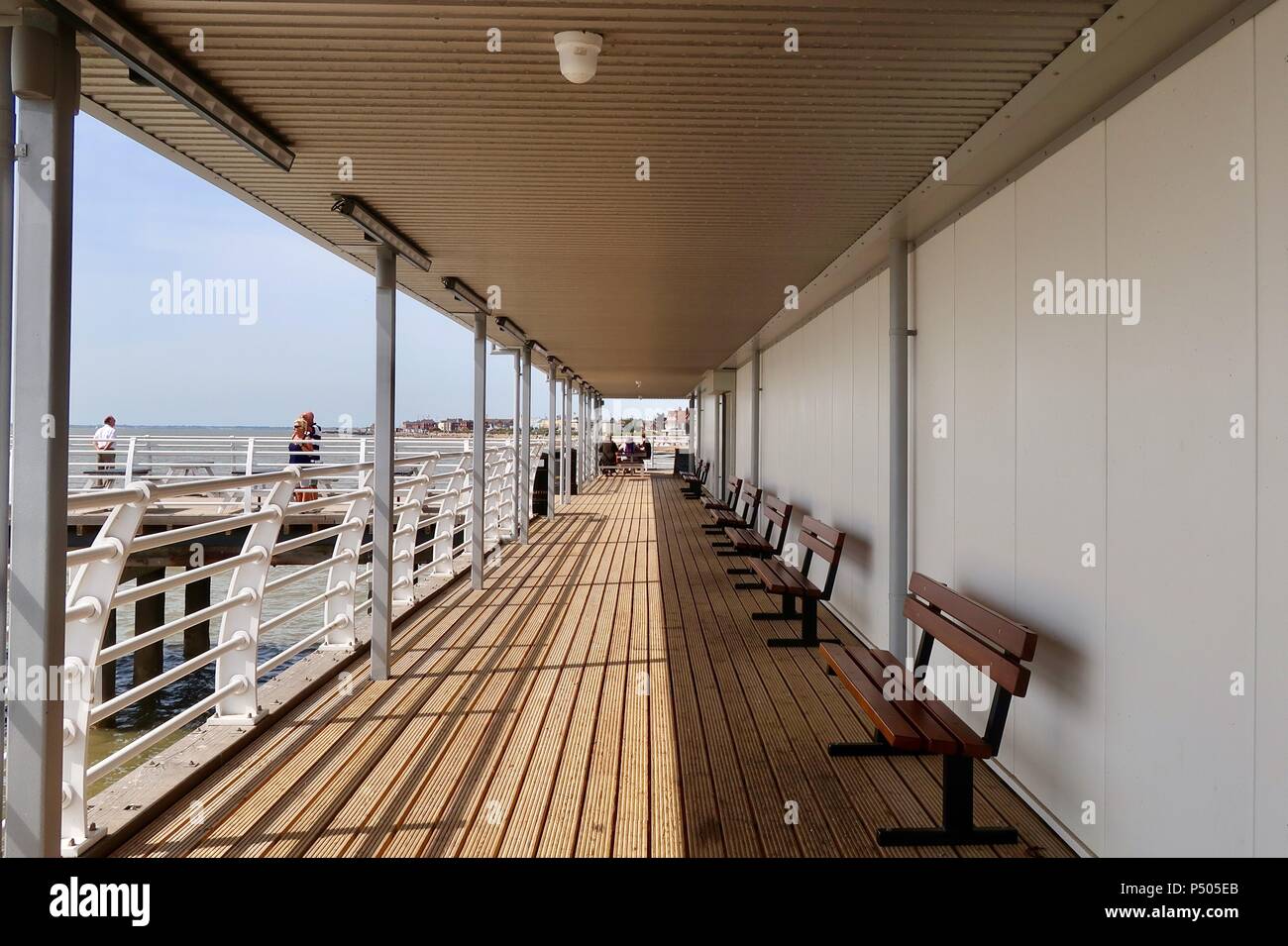 Felixstowe, Suffolk on a bright summer morning, June 2018. Converging lines on the pier. Stock Photo