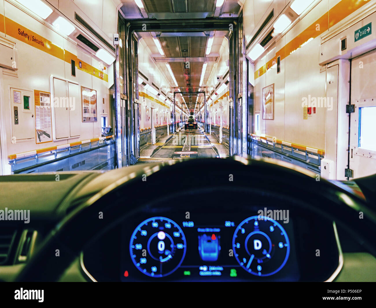 Drivers eye view of the drive in a car onto the eurotunnel train Stock Photo