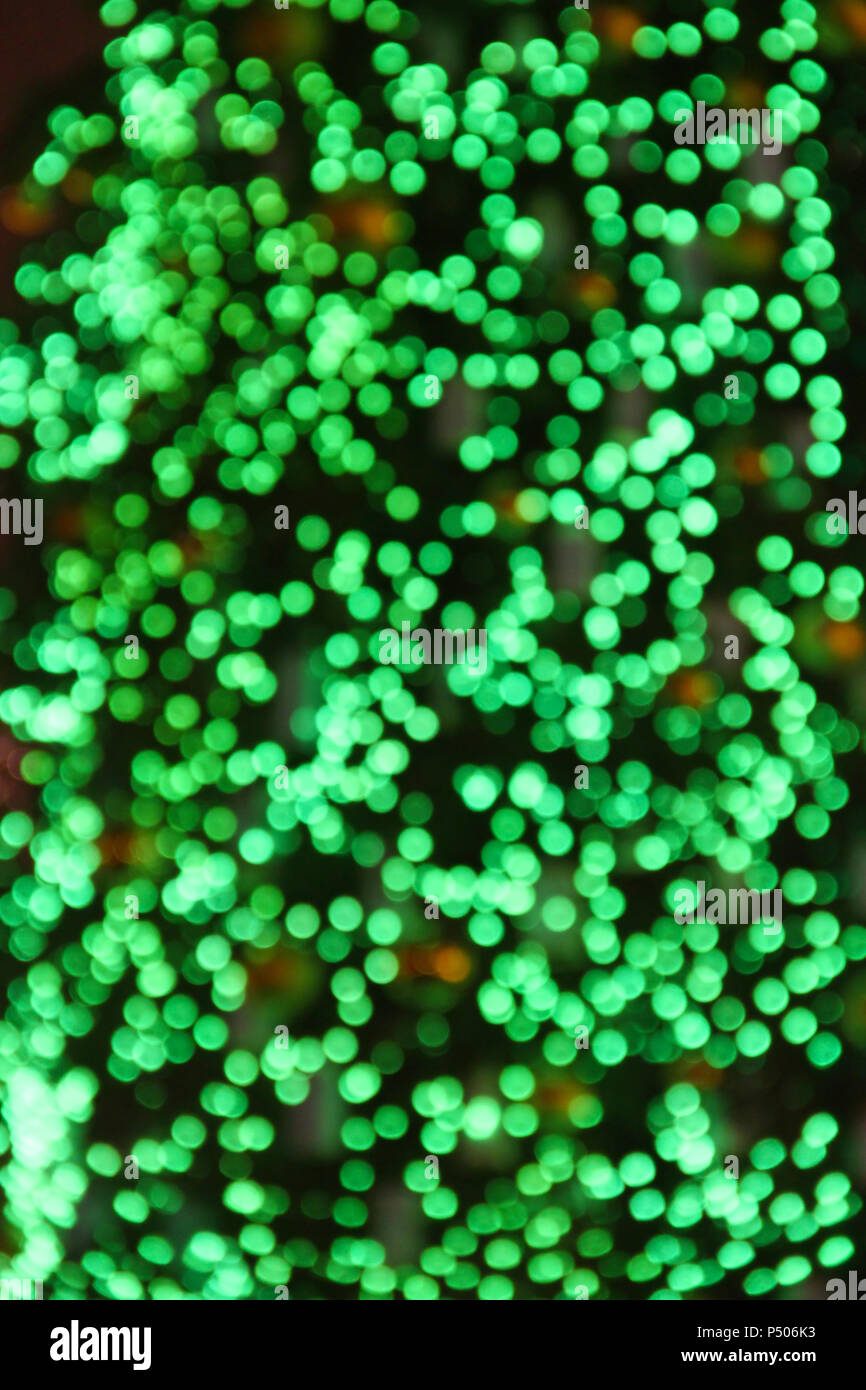 Green abstract bokeh background with new year tree lights Stock Photo
