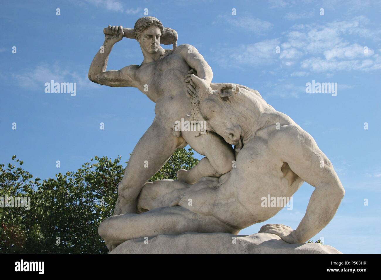 Classical Mythologi. Theseus slaying Minotaur. Statue 19th century AD. The Garden of the Tulleria (Tuileries). Paris. France. Europe. Stock Photo