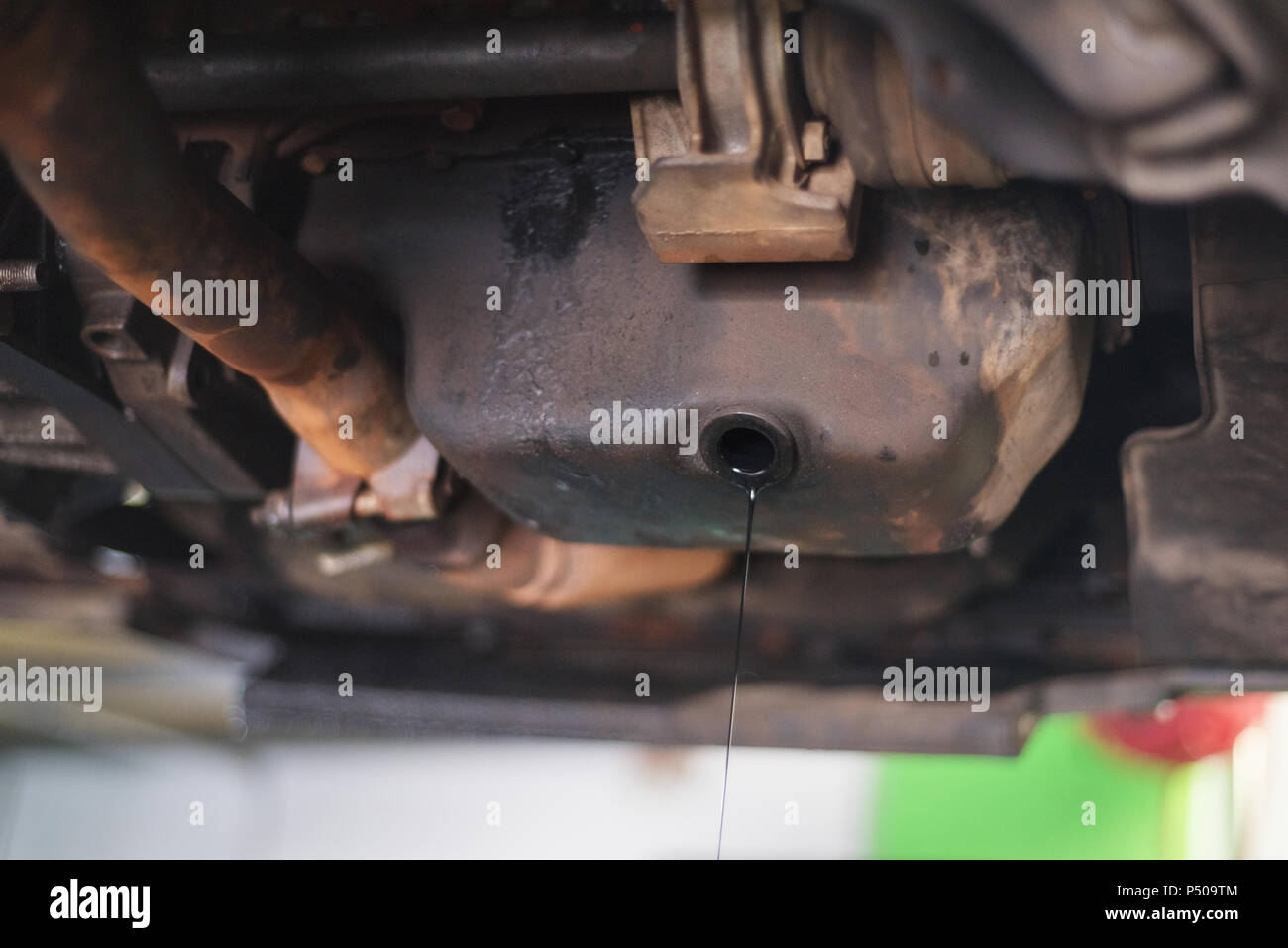 removing used engine oil Stock Photo Alamy