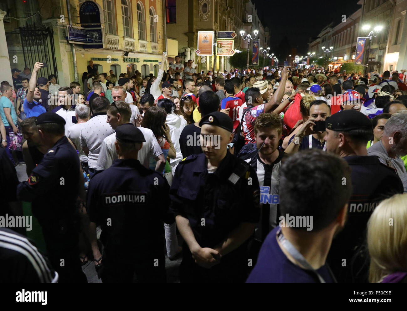 Russian police separate England and Panama fans in Nizhny Novgorod ahead of their match on Sunday at the 2018 FIFA World Cup in Russia. Stock Photo