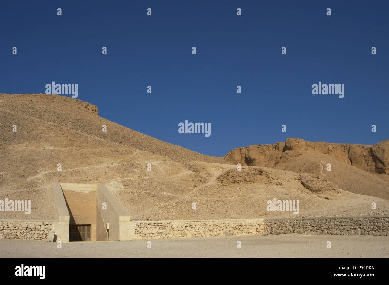 Valley of the Kings. On the walls are carved rock tombs of New Kingdom pharaohs. Entrance to the tomb of the Pharaoh Ramses IV. Egypt. Stock Photo