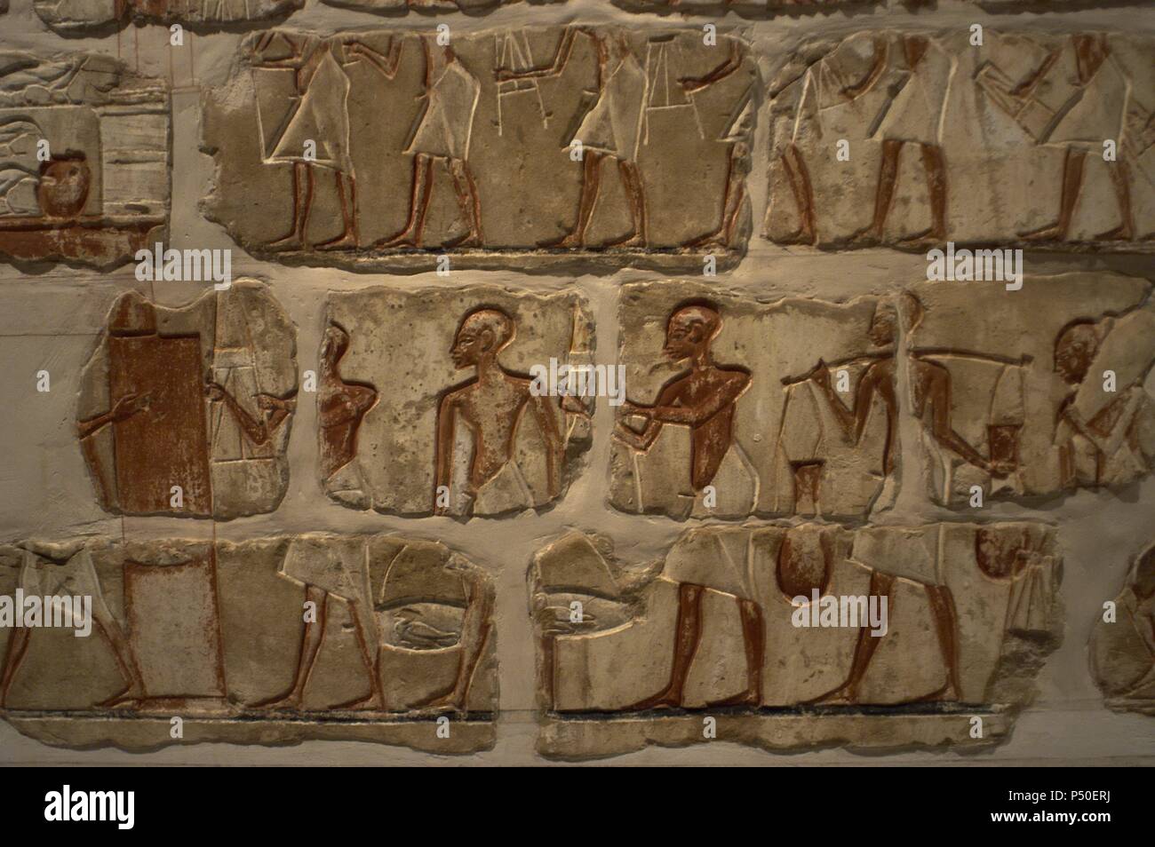 Egyptian art. Talatat walls from the temple of Amenhotep IV. Composed of 283 blocks of polychromed sandstone. Storage of goods in the temple. 18th Dynasty. New Empire. Luxor Museum. Egypt. Stock Photo
