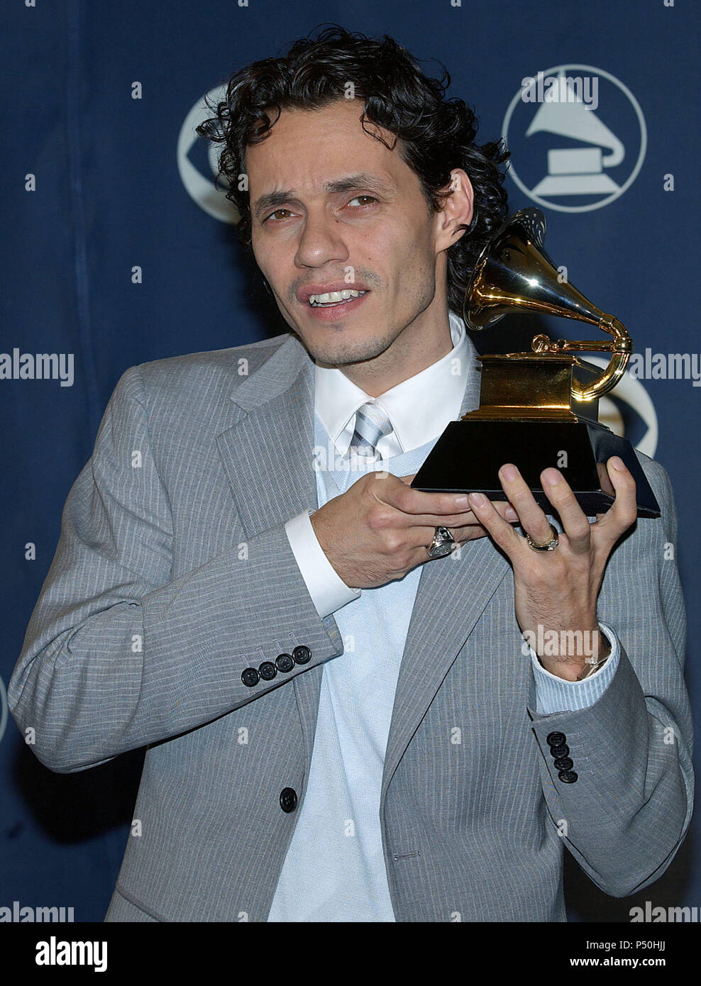 Marc Anthony backstage at the 47th Annual Grammy Awards at the Staple
