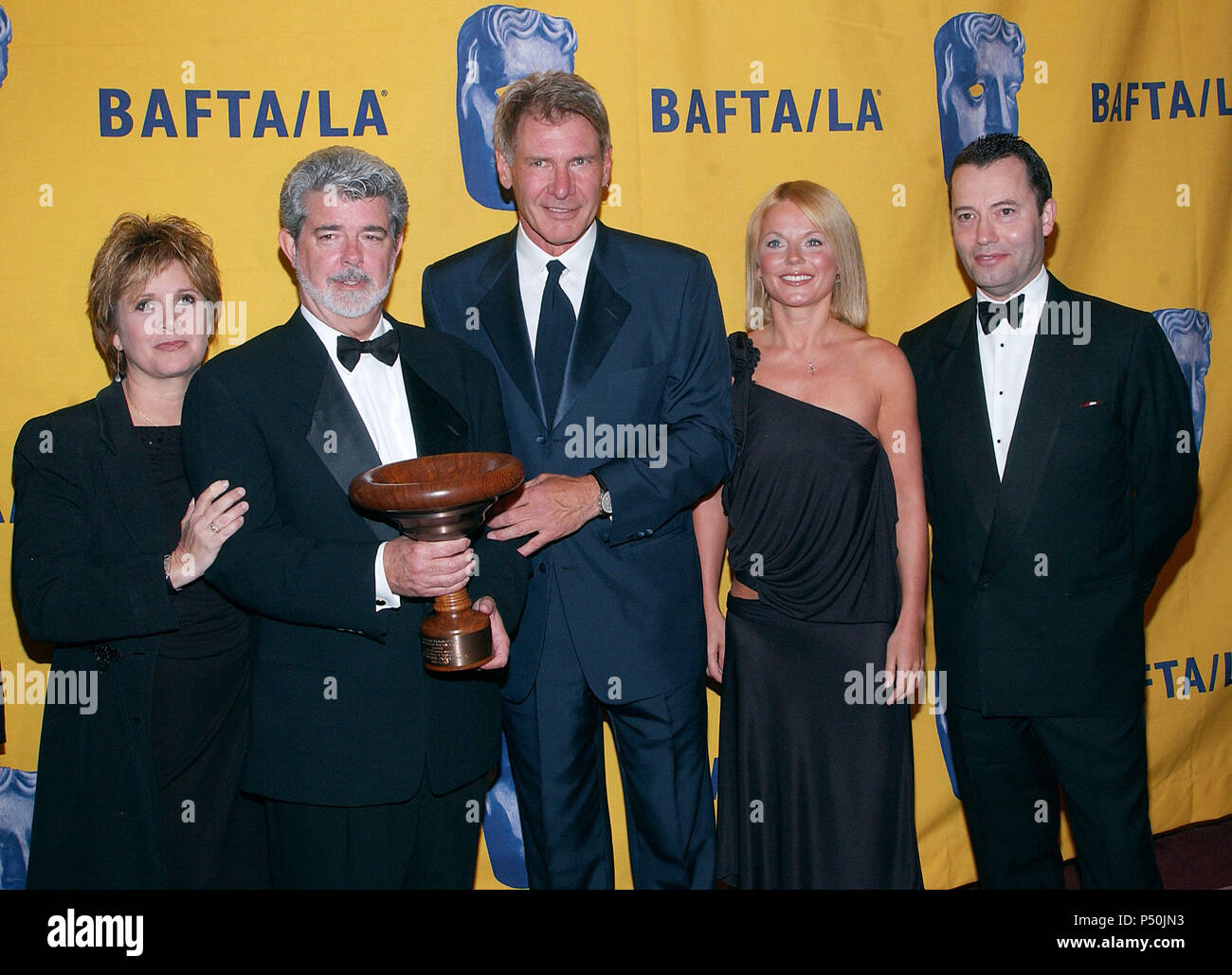 Carrie Fisher, George Lucas, Harrsion Ford, Geri Halliwell and Colin Callender (HBO president Film),  at The 11th Annual BAFTA-LA -Britannia Awards presented to George Lucas at the Beverly Hilton in Los Angeles. April 12,  2002.             -            BaftaLA to Lucas23.jpgBaftaLA to Lucas23  Event in Hollywood Life - California, Red Carpet Event, USA, Film Industry, Celebrities, Photography, Bestof, Arts Culture and Entertainment, Topix Celebrities fashion, Best of, Hollywood Life, Event in Hollywood Life - California,  backstage trophy, Awards show, movie celebrities, TV celebrities, Music Stock Photo