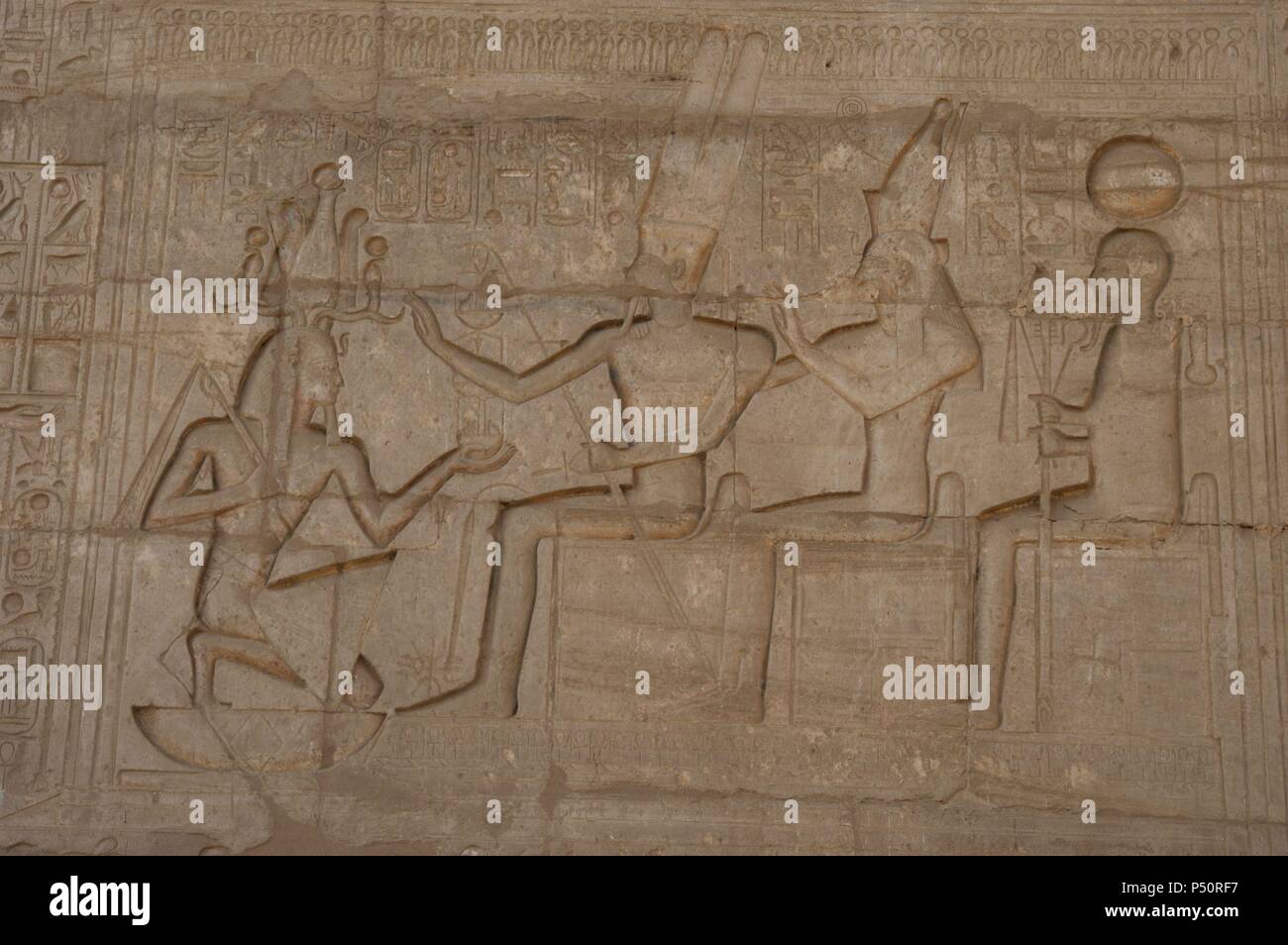 Relief depicting a Pharaoh Ramses II before gods Amun, Munt and Khonsu. Ramesseum. 13th century. Nineteen dynasty. New Kingdom. Necropolis of Thebes. Valley of the kings. Egypt. Stock Photo