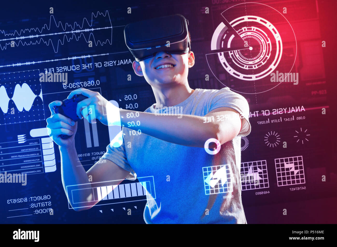 Excited man holding a game console while wearing virtual reality ...