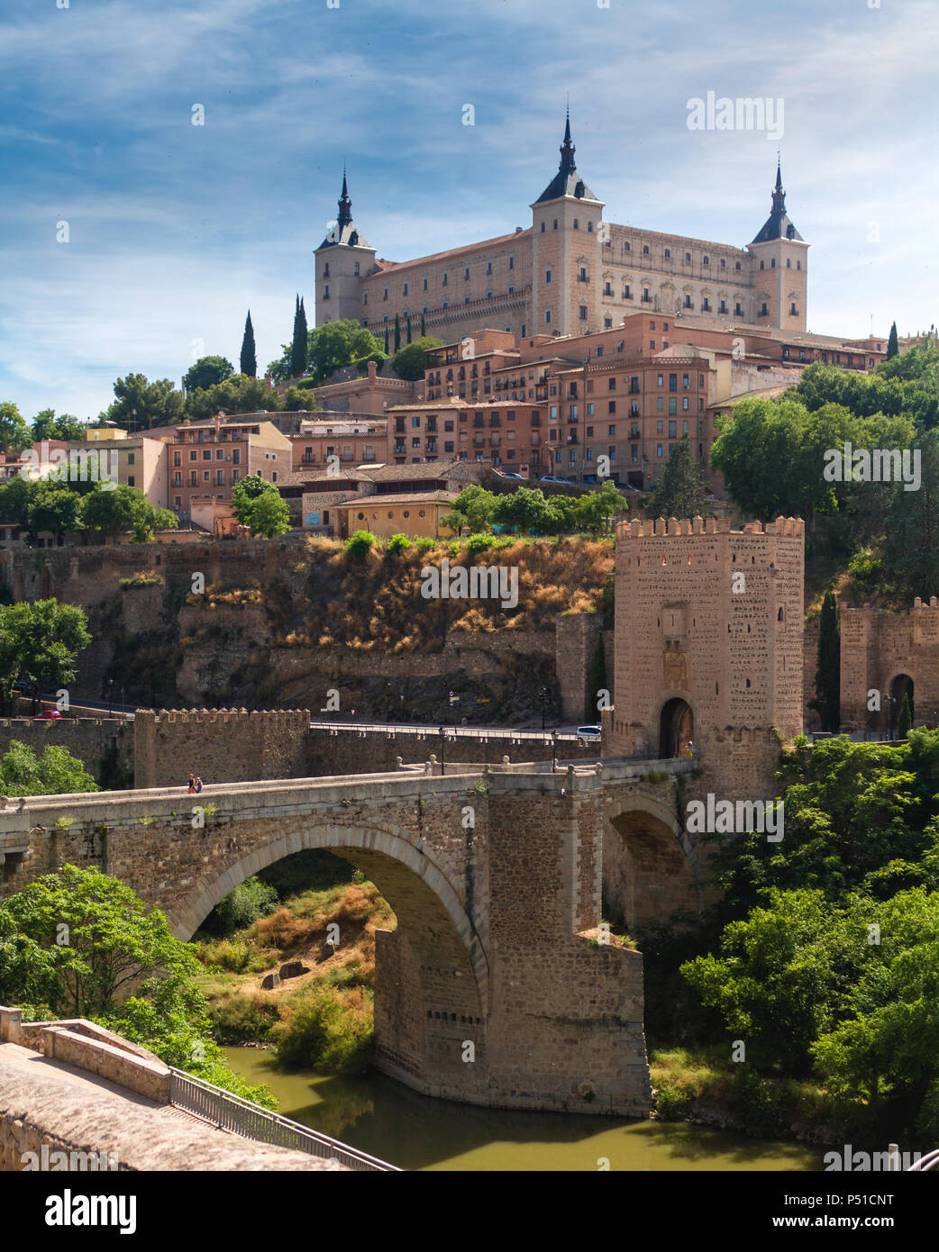 Roman bridge, Alcantara Bridge with Alcazar fortress, and Tagus River  Toledo Spain Stock Photo - Alamy