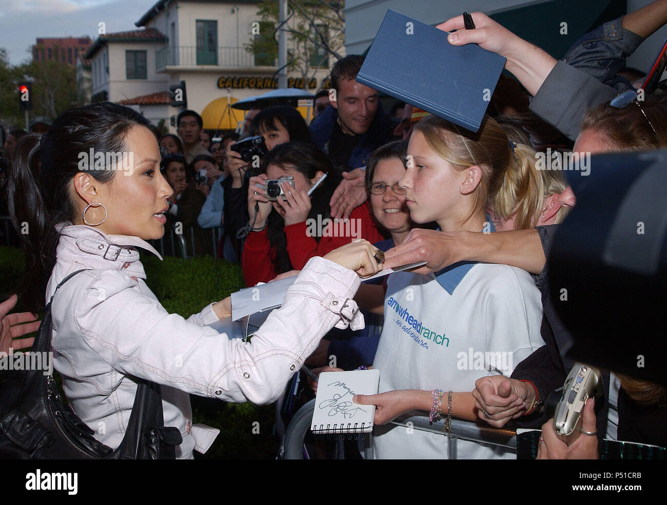 Lucy Liu signing autograph at the 