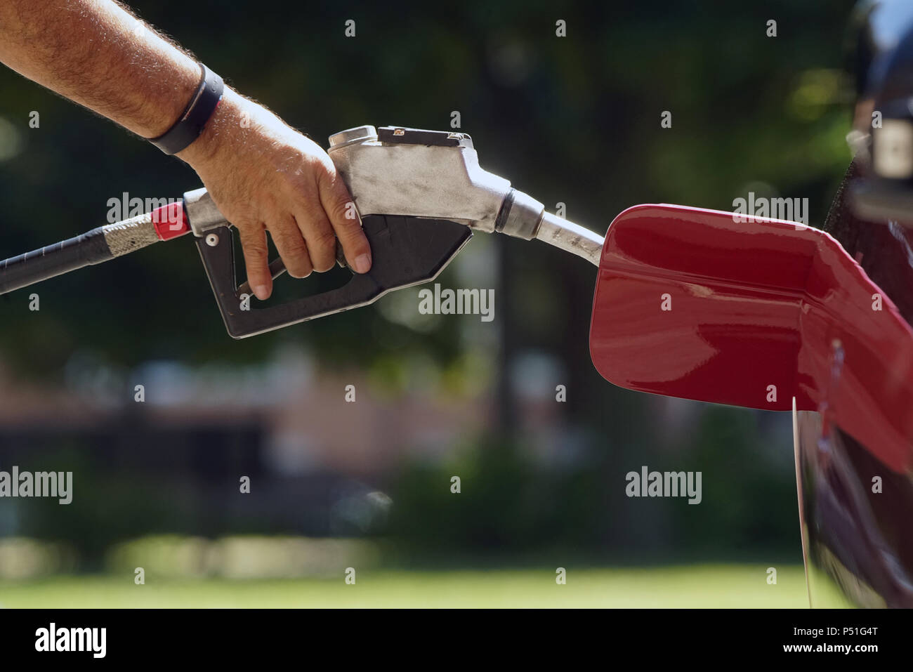 Montreal,Canada,15 June 2018.Hand holding a gas pump nozzle.CreditMario Beauregard/Alamy Live