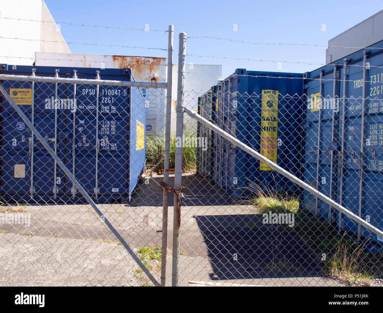Shipping Containers In A Yard Behind A Security Fence Stock Photo Alamy
