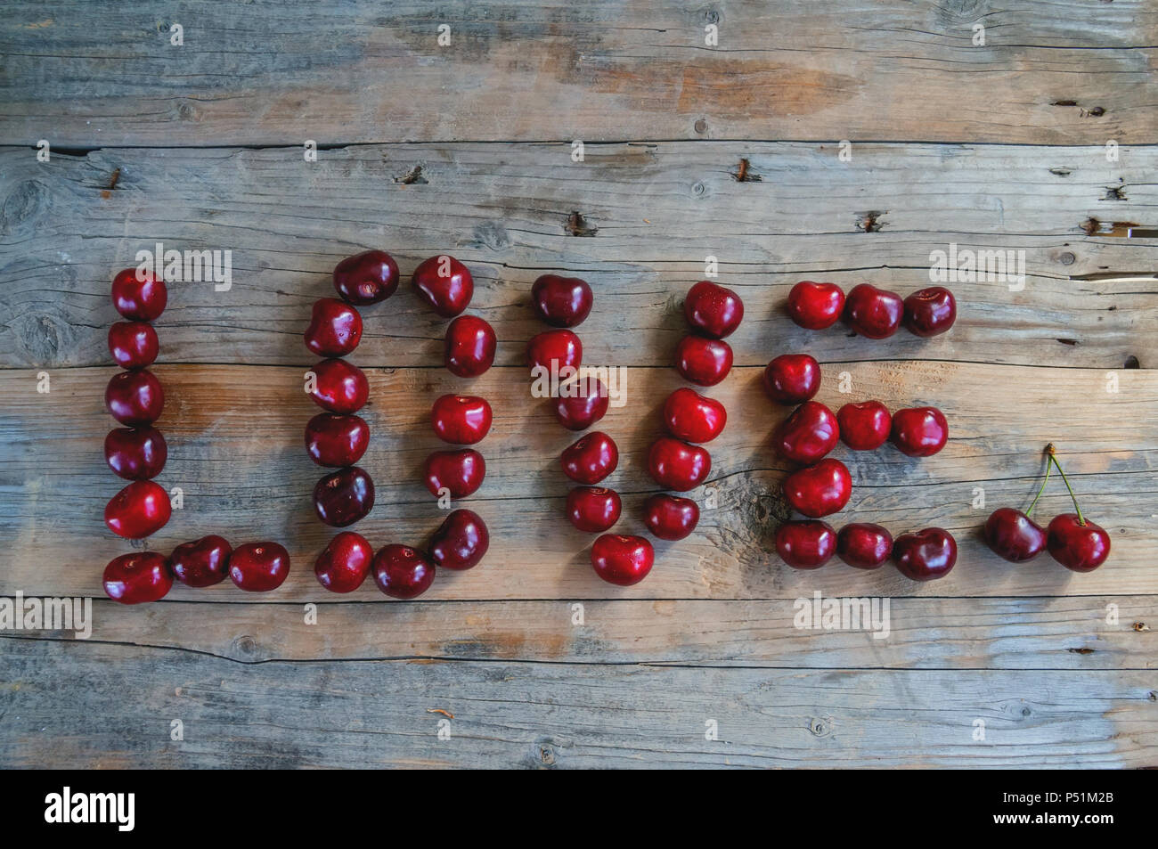 Love word made from cherries. Love concept. Stock Photo