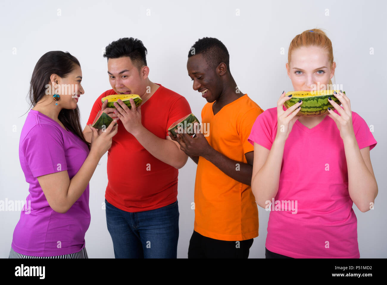 Studio shot of happy teenage girl with diverse group of multi et Stock Photo