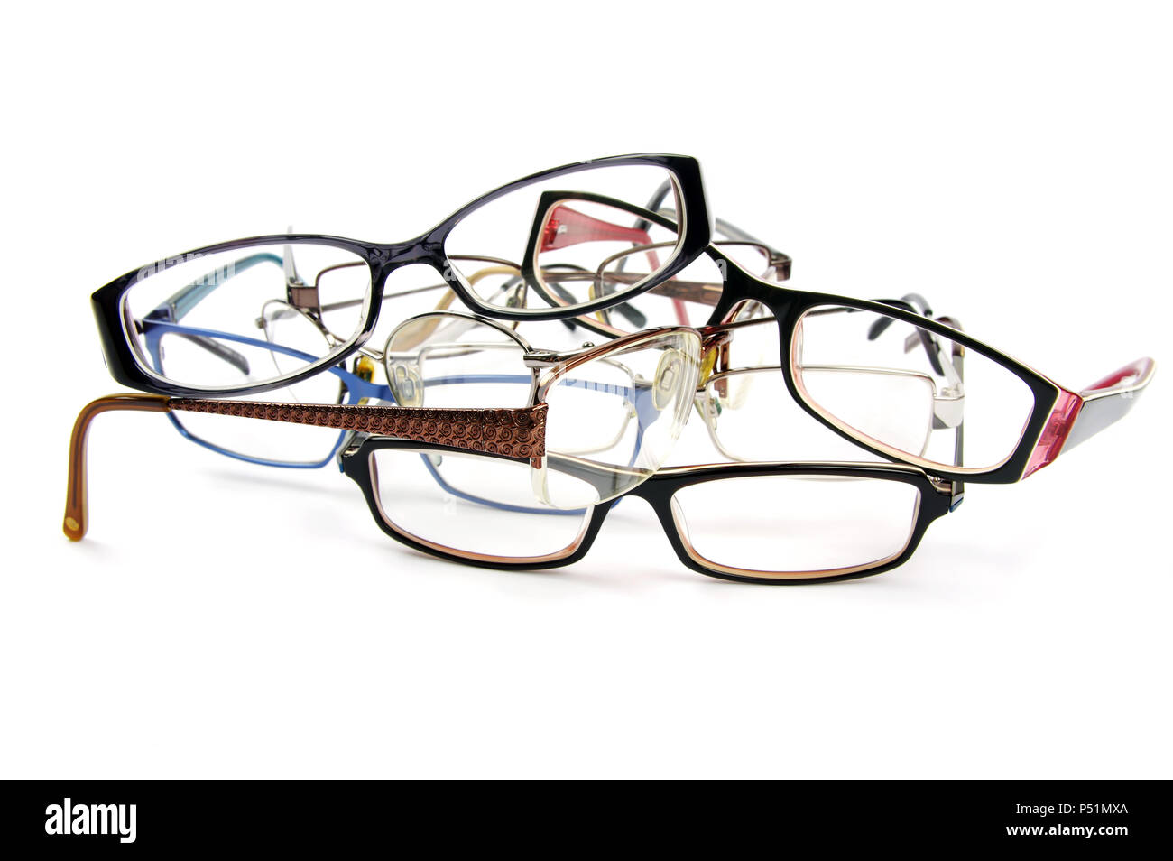 pile of old reading glasses on a white background close up view Stock Photo