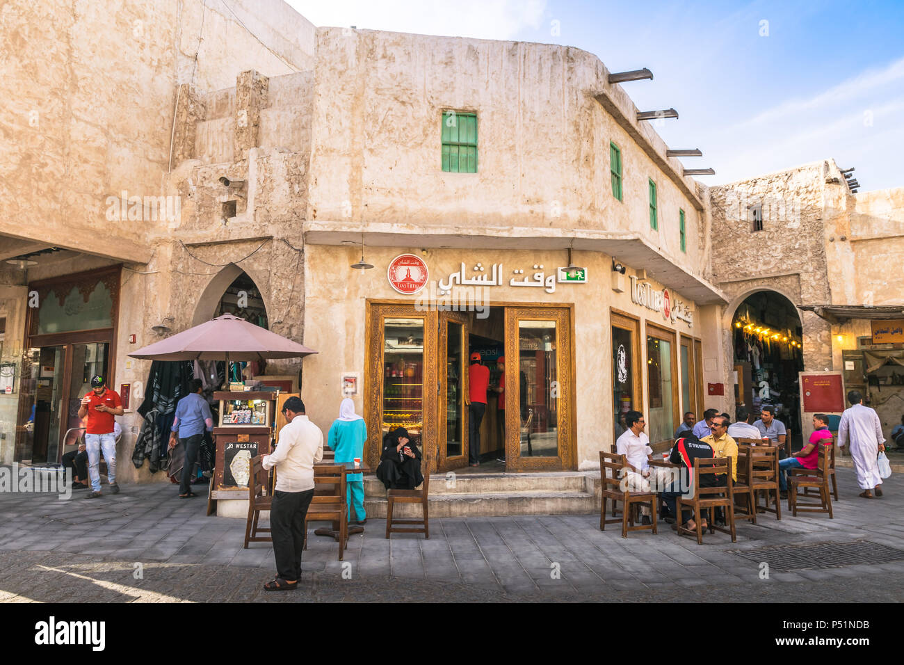 Doha, Qatar Mart, 2018 People sitting and relaxing in coffee shop at