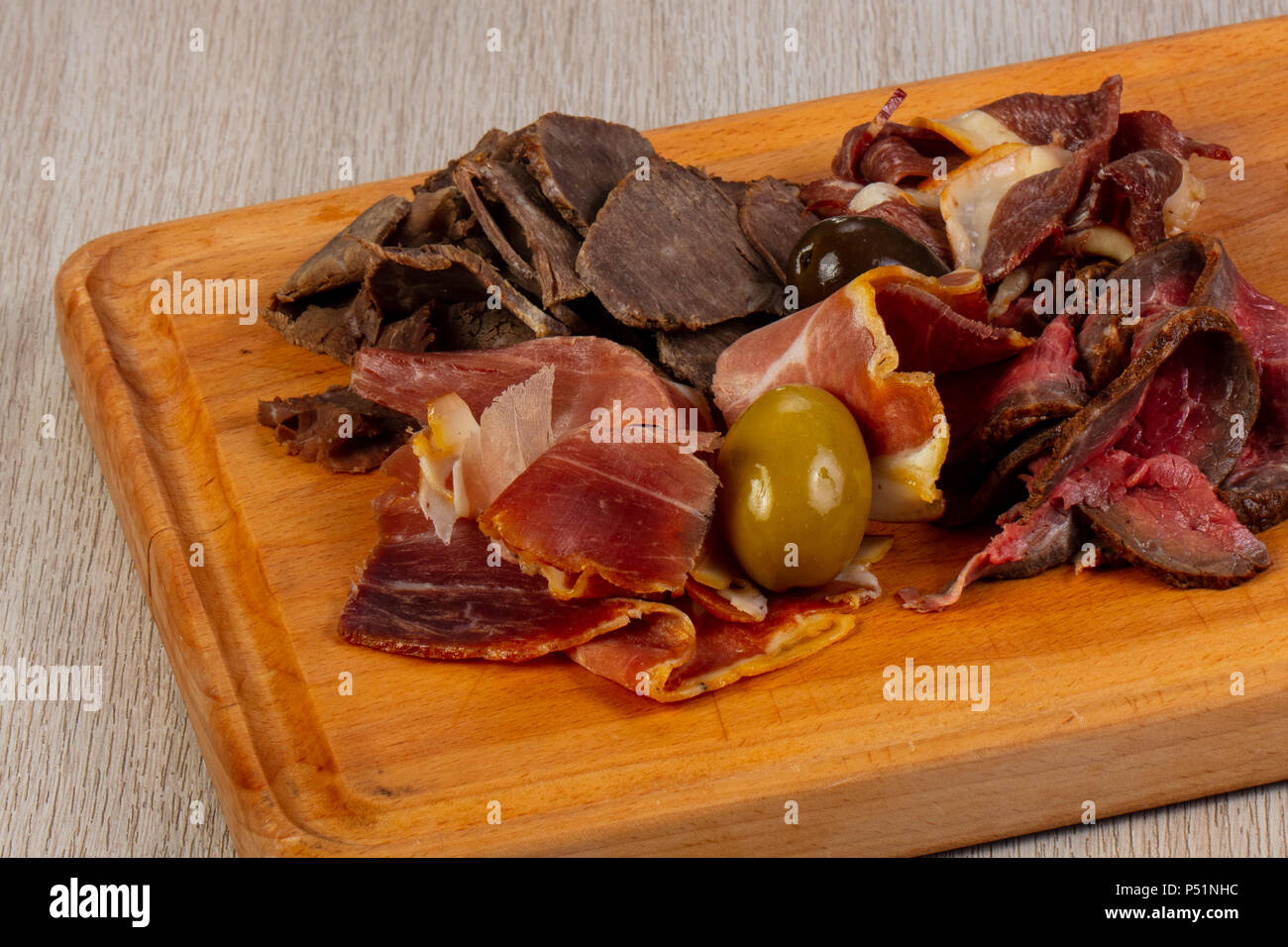 Meat plate mix snack with olive Stock Photo