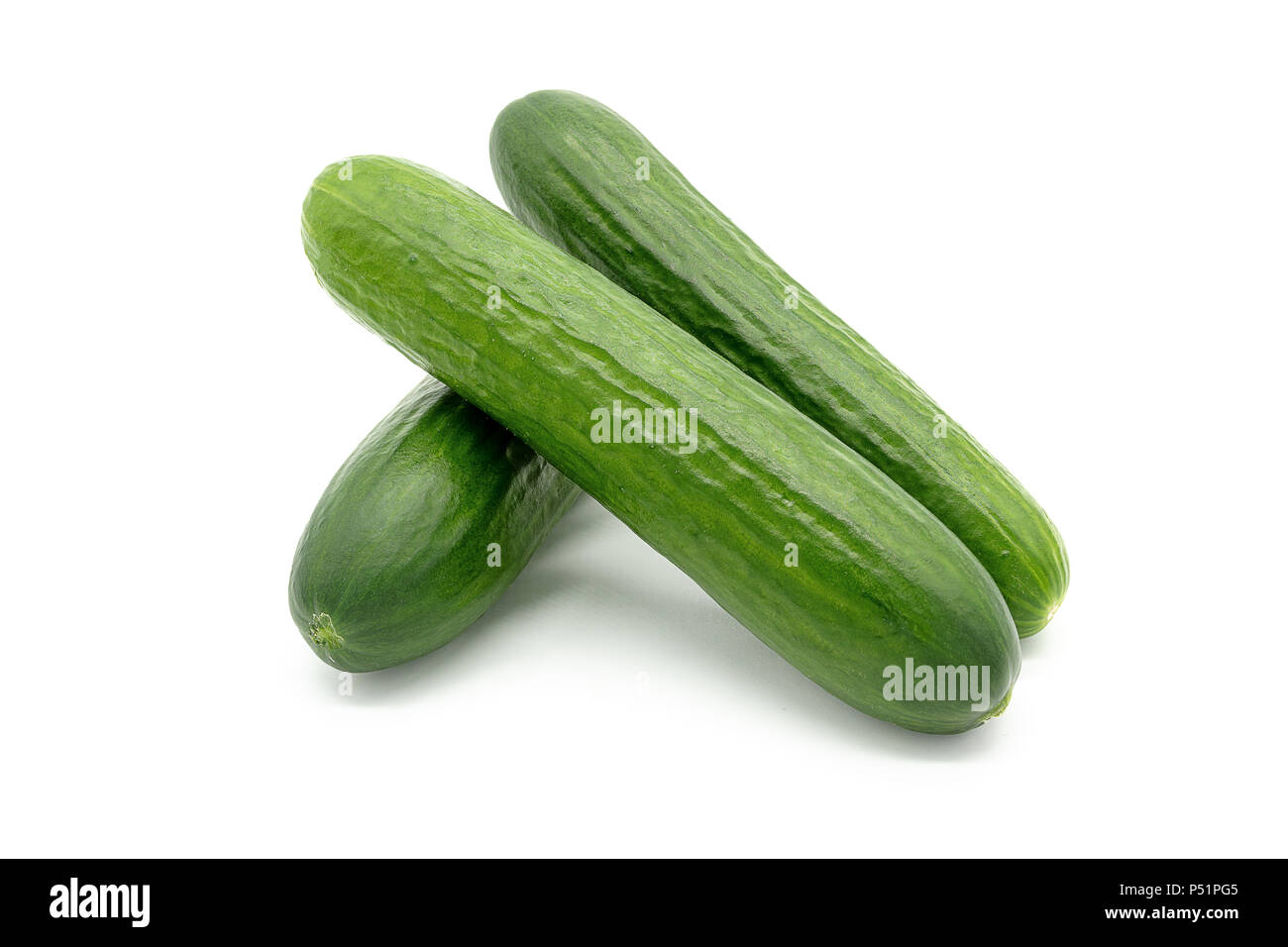 three cucumbers on a white background Stock Photo