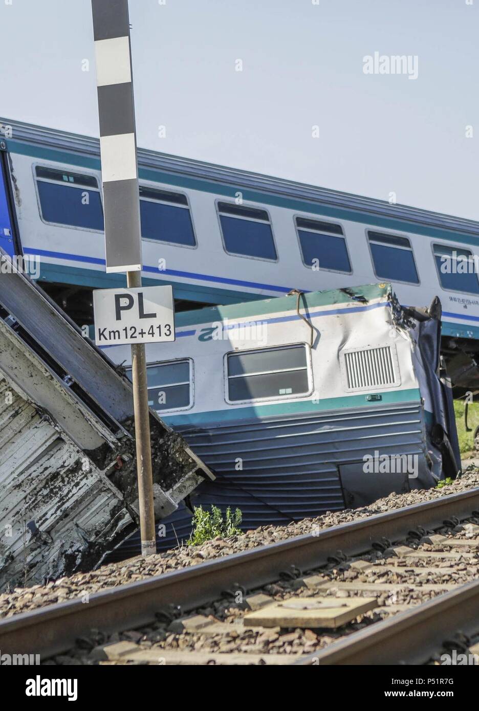 At least two people have been killed and 18 injured after a train crashed into a lorry and